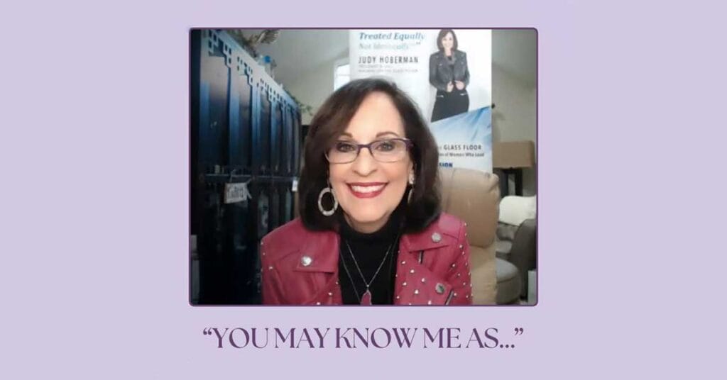 a woman wearing glasses and a red jacket