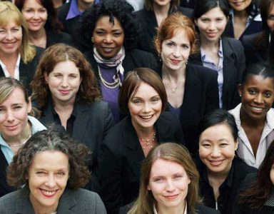 a large group of women in suits and ties